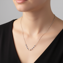 Load image into Gallery viewer, Blue Bead Sideways Cross